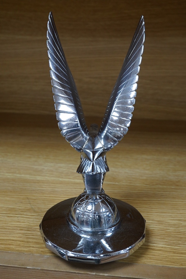 A 1920s/30s French Art Deco ‘eagle on a globe’ car mascot by Casimir Brau for the car manufacturer Messier, mounted to a threaded radiator cap, height 23cm. Condition - good.